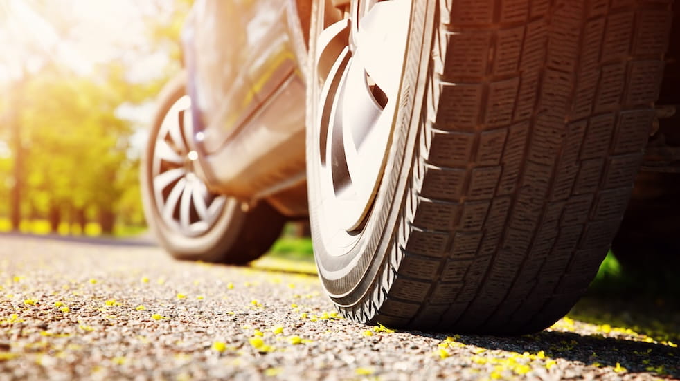 Car on asphalt road in summer